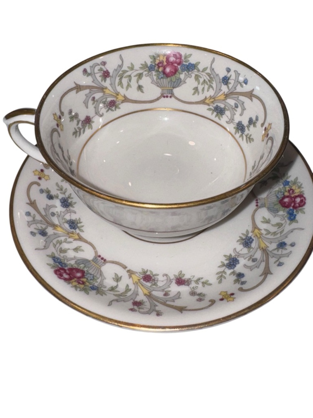 Fine Porcelain Teacup and Saucer Set with Pink Floral Motif and Gold Trim